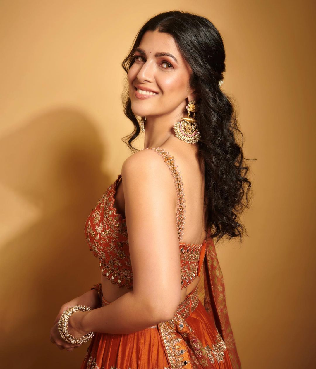 Bollywood Actress Nimrat Kaur Stills In Orange Lehenga Choli